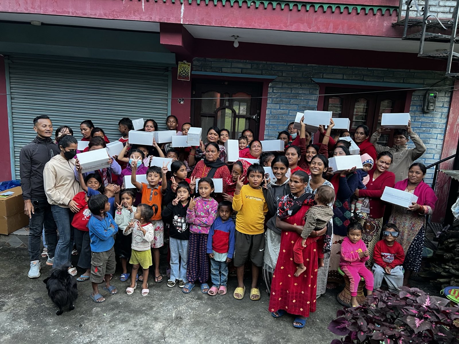 Nepali people being given new shoes